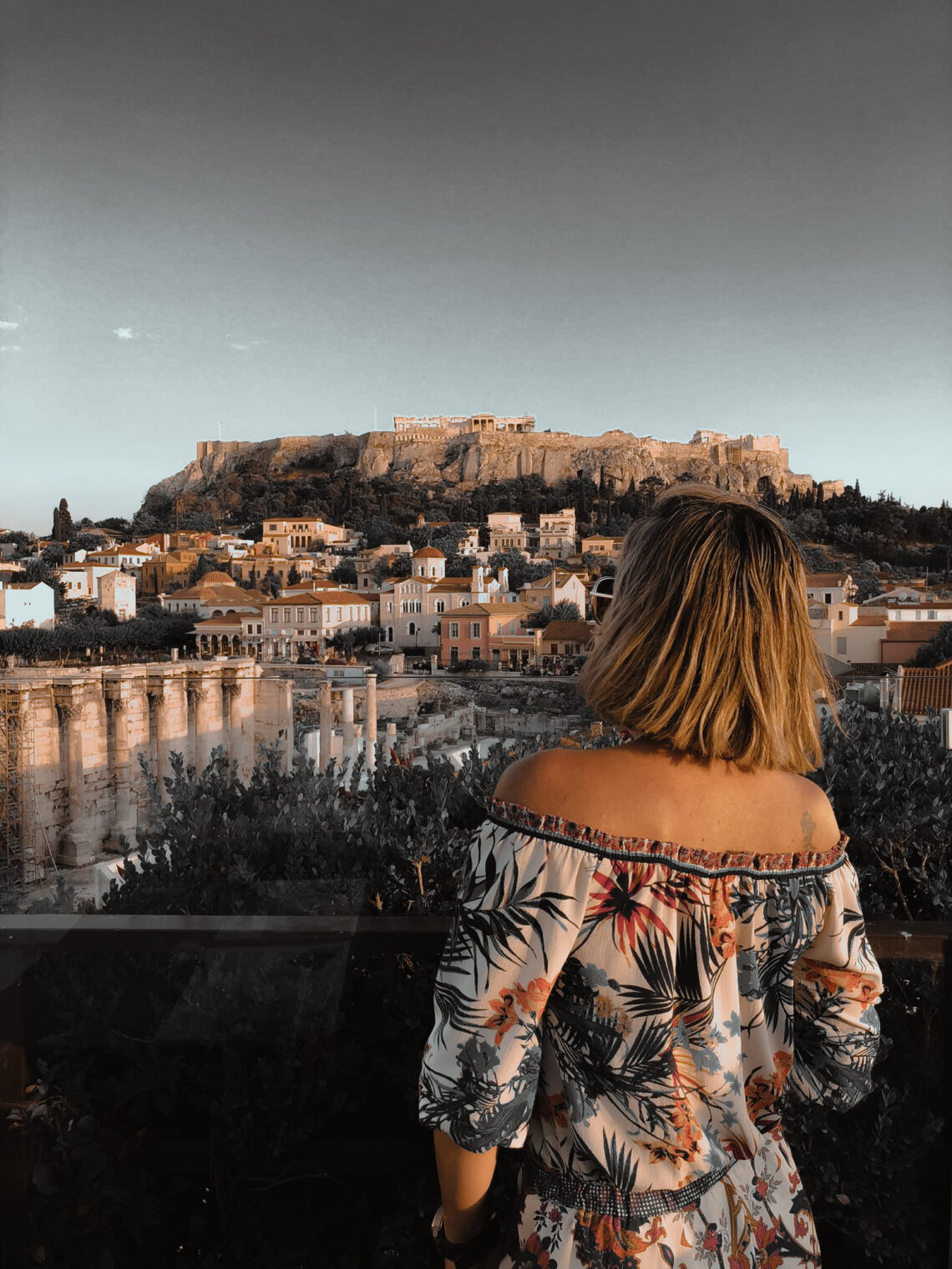 woman overlooking the acropolis in greece