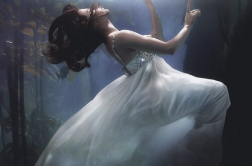 woman floating underwater